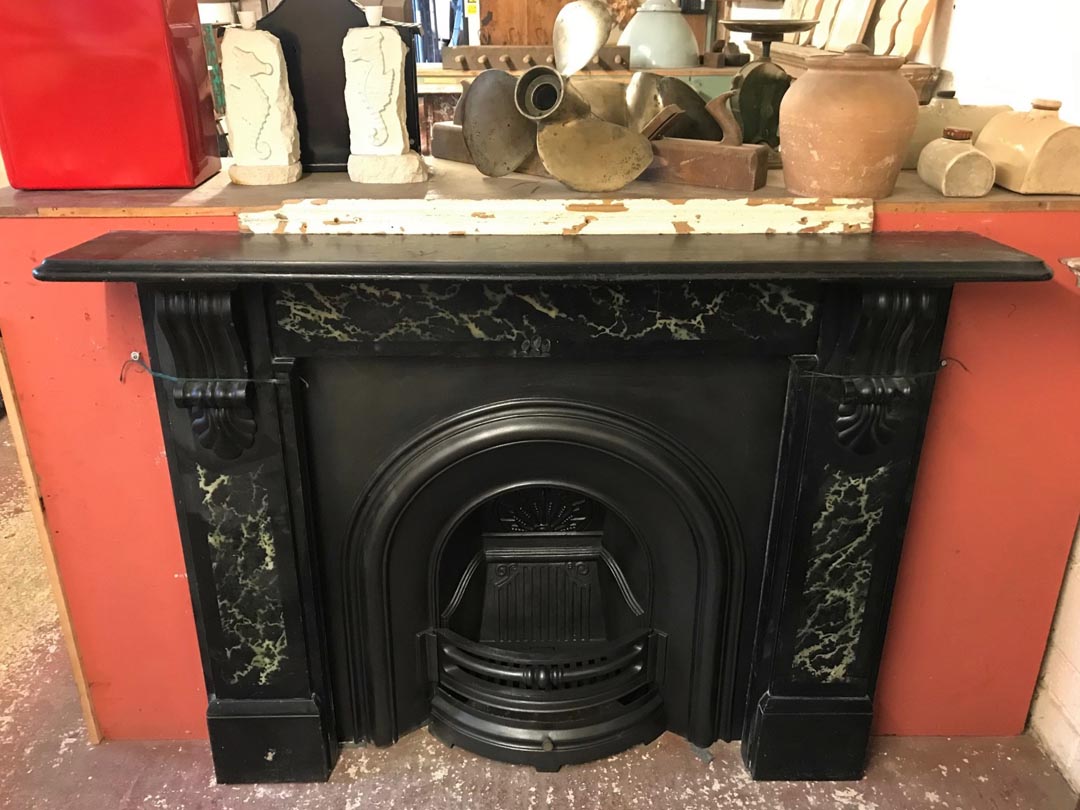 <p>Original slate surround with marble effect detail.
